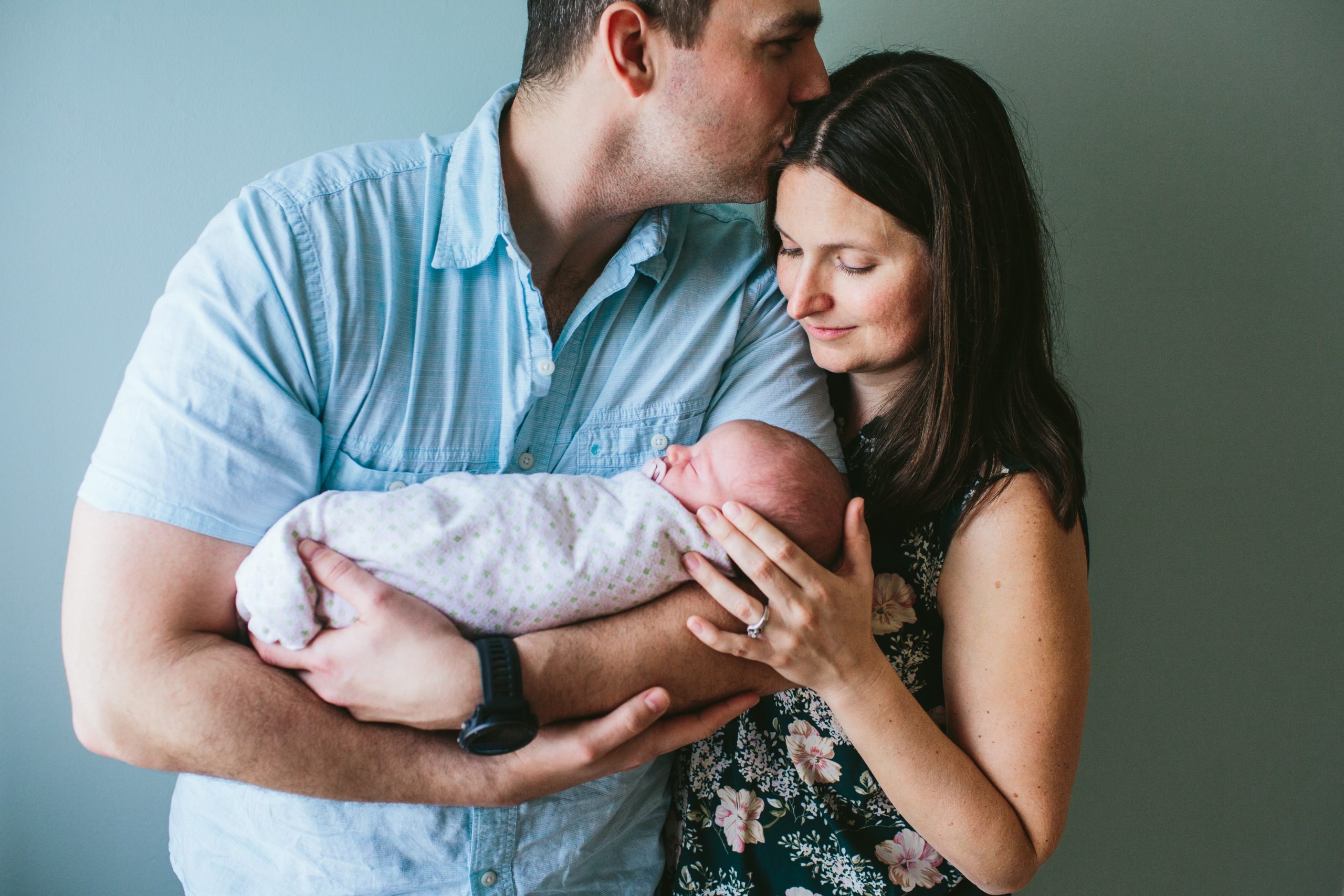 husband and wife with baby